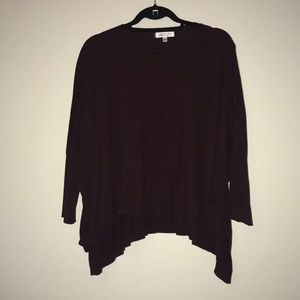 Maroon tunic with fake buttons on the sleeve